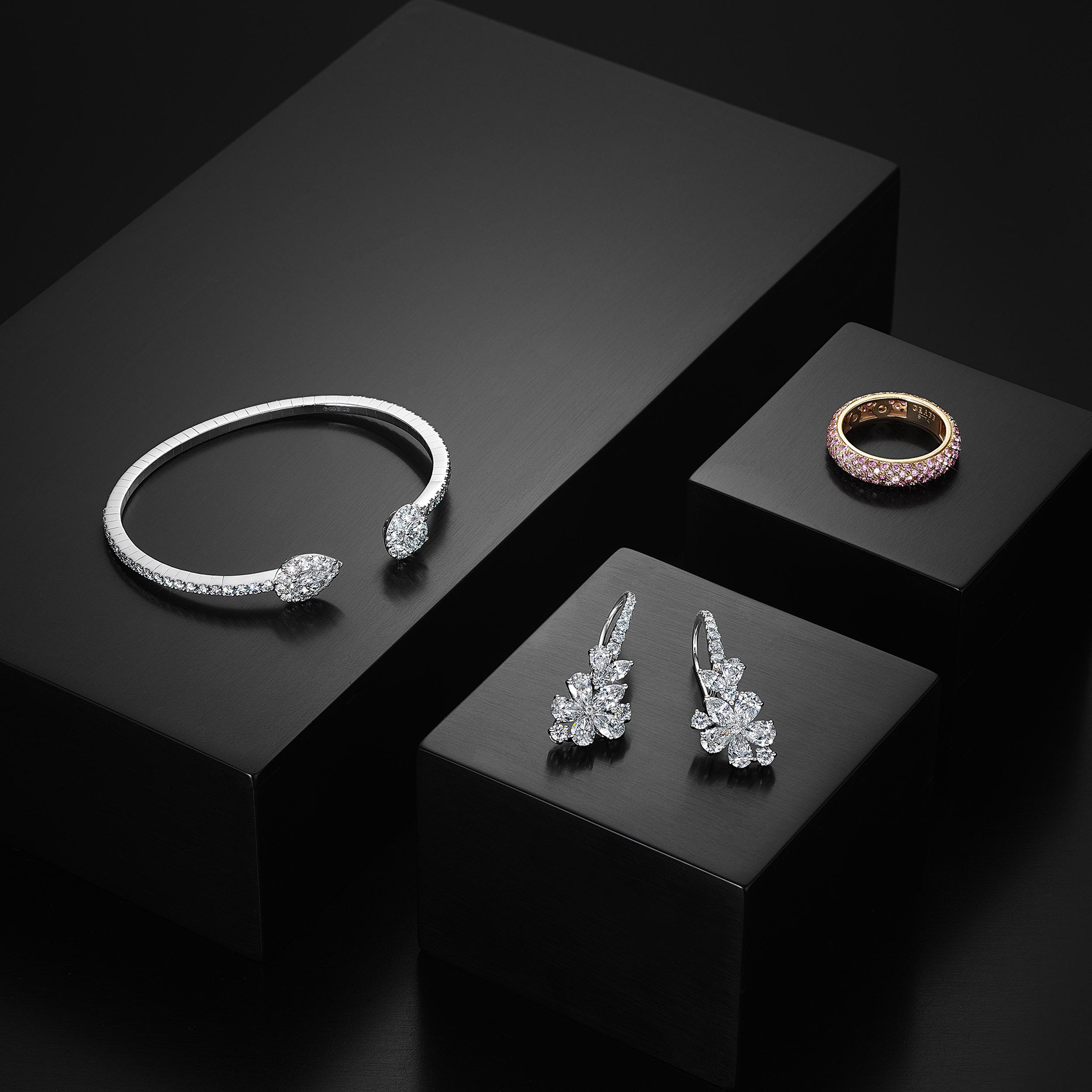 Three Diamond Jewelry Pieces on Boxes